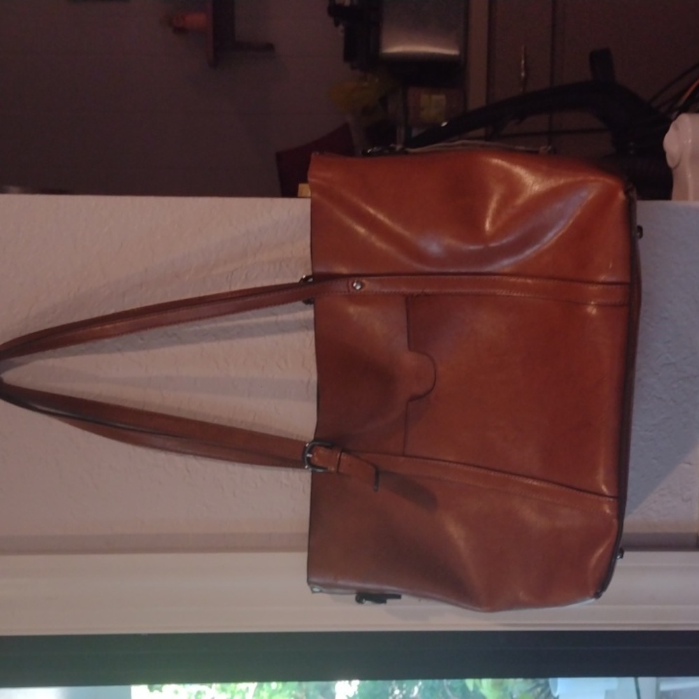 This is a brown leather computer bag
